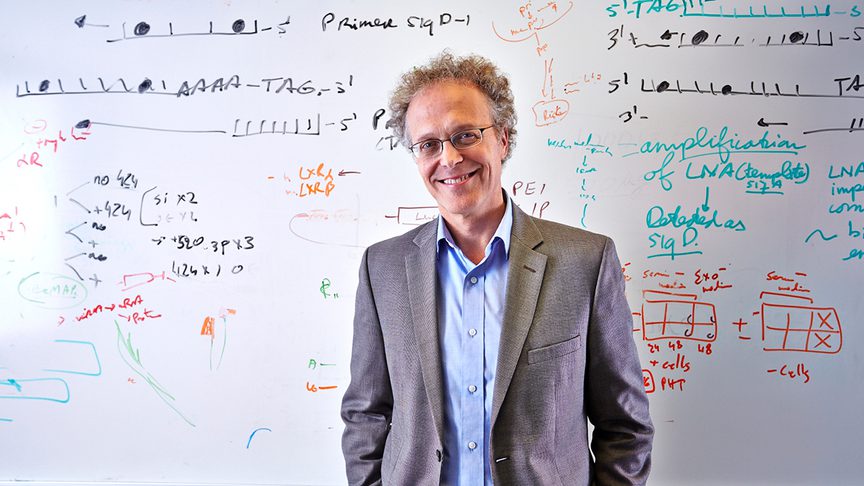 Dr Yoel Sadovsky standing in front of a whiteboard.