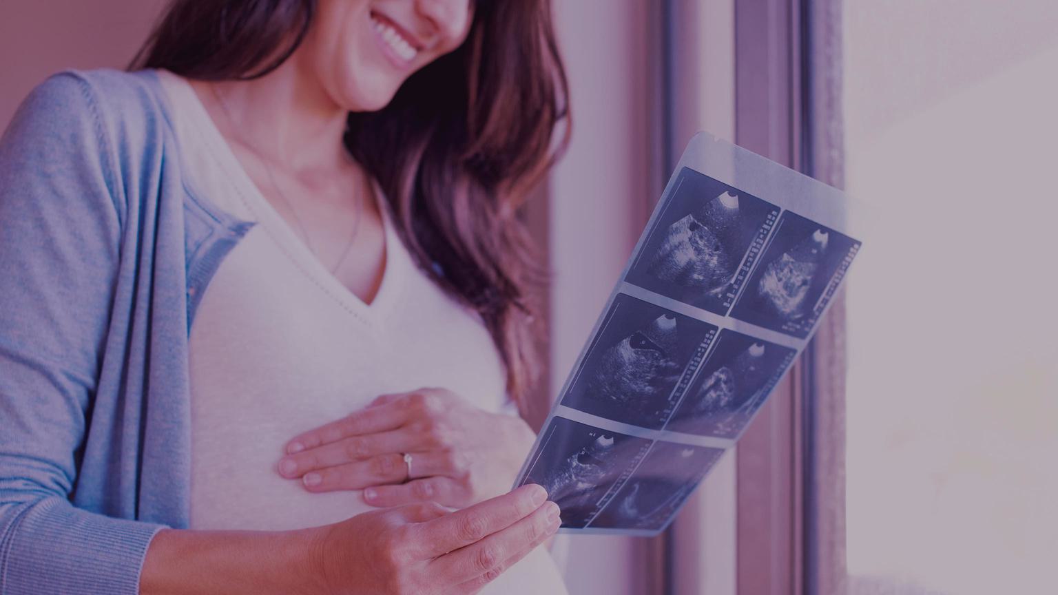 An expectant mother looking at test results.